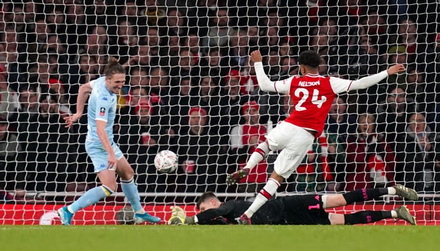 Arsenal's Reiss Nelson scores his side's first goal of the game during the FA Cup third round match at Emirates Stadium 