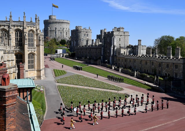 The Foot Guards Band are seen marching outside St George’s Chapel, Windsor Castle, Berkshire
