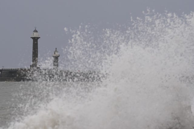 Waves hitting the sea wall in Whitby