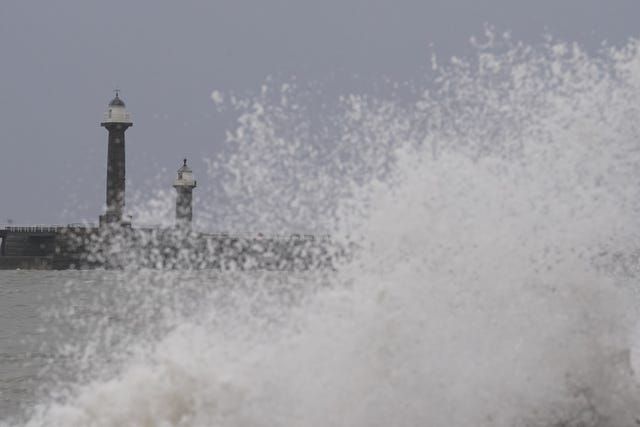 Waves hitting the sea wall in Whitby