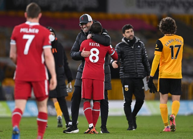 Liverpool manager Jurgen Klopp celebrates with Naby Keita