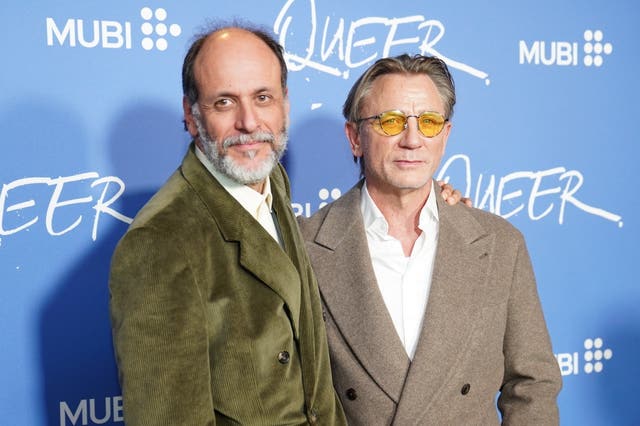 Luca Guadagnino with his arm around Daniel Craig at a screening for Queer