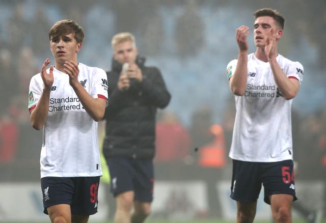 Liverpool's James Norris, left, and Tony Gallagher applaud fans after the final whistle 