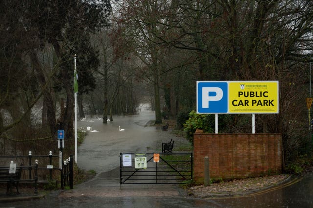 A car park is covered with water after the River Severn burst its banks in Worcester (Jacob King/PA)
