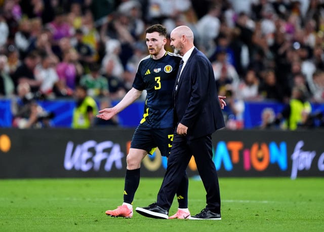 Scotland captain Andy Robertson, left, speaks to manager Steve Clarke after defeat to Germany