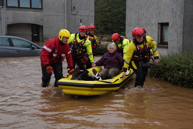 Person being evacuated from their homes in a kayak