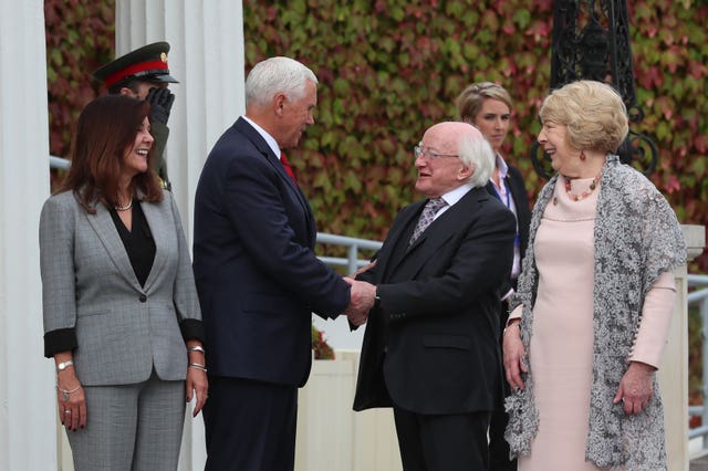 Mr Pence and his wife Karen leaving Aras an Uachtarain after meeting Michael D Higgins and wife Sabina
