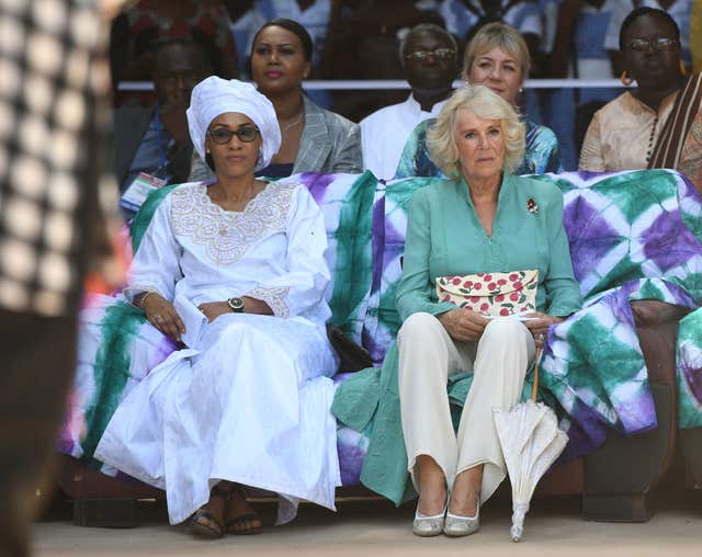 The First Lady of the Gambia Fatou Bah-Barrow and the Duchess of Cornwall watch a performance during a visit to St Teresa’s School in the Gambian capital. Joe Giddens/PA Wire