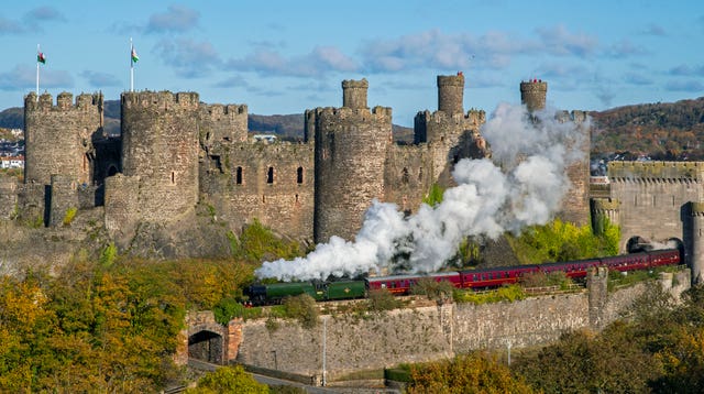 The Flying Scotsman passes Conwy Castle, North Wales (Peter Byrne/PA)