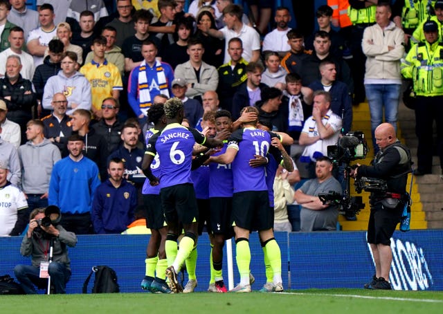 Tottenham players celebrate after Pedro Porro put them 2-0 up at Leeds 