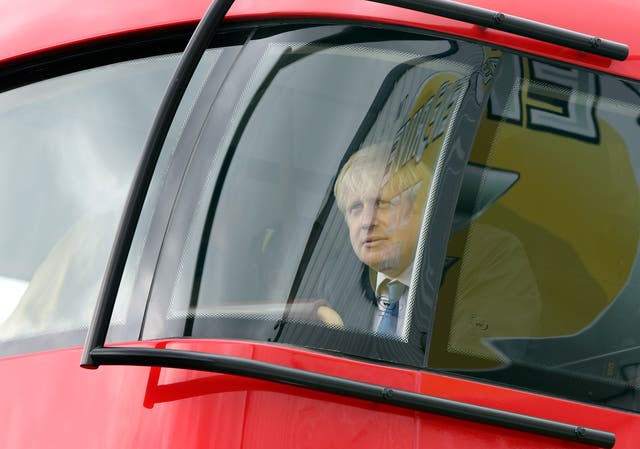 Boris Johnson, when he was London mayor, in a new London bus during a tour of Wrightbus factories in Ballymena and Antrim (Paul Faith/PA)