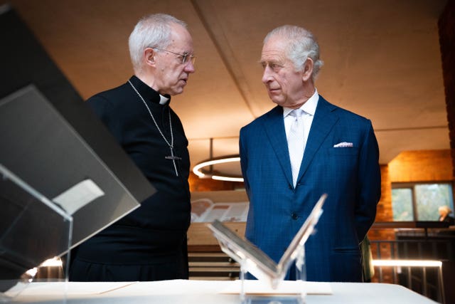 Justin Welby and the King speaking in archives