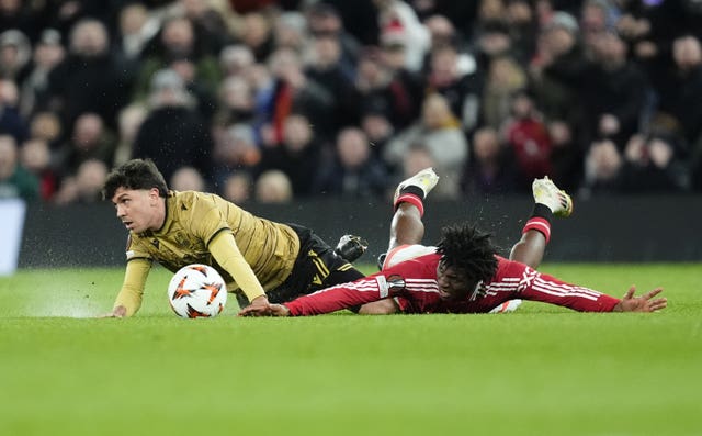 Manchester United’s Patrick Dorgu (right) likes on the ground with arms outstretched after being fouled by Real Sociedad’s Jon Aramburu, resulting in a red card