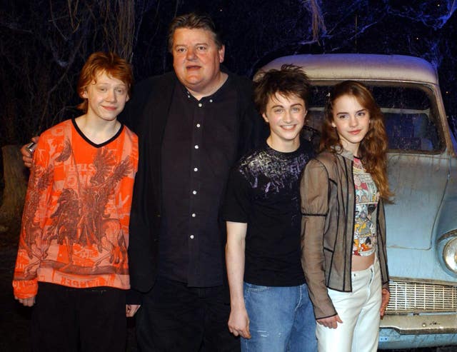 The stars of Harry Potter And The Chamber Of Secrets, from left to right; Rupert Grint, Robbie Coltrane, Daniel Radcliffe Emma Watson, during the worldwide launch of the DVD/VHS at Leavesden Studios in north London on April 8 2003 