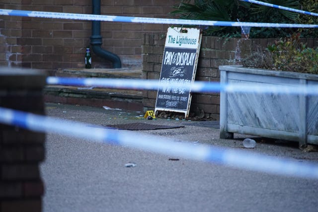 Crime scene tape and evidence markers at the Lighthouse Inn in Wallasey 