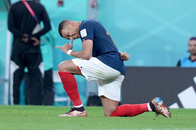 Kylian Mbappe celebrates after scoring against Poland