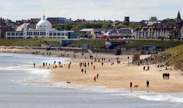 People on the beach at Whitley Bay