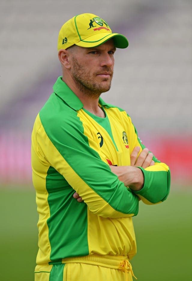 Australia’s Aaron Finch crosses his arm while on the field