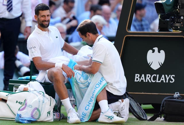 Novak Djokovic receives treatment to his thigh 