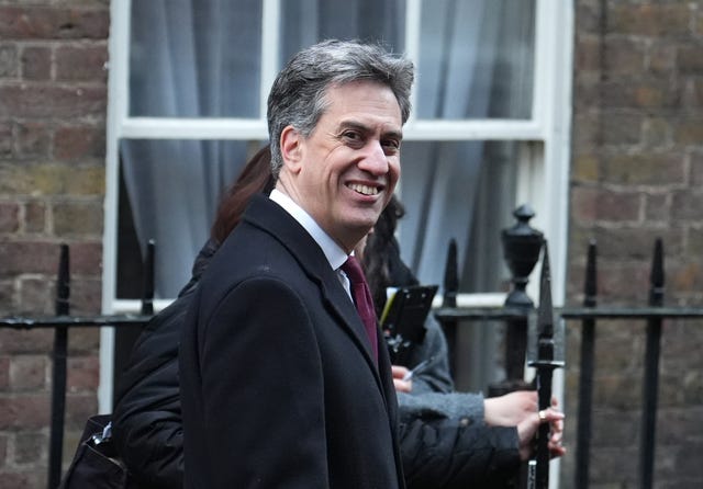 Ed Miliband smiles as he arrives for a Cabinet meeting at Lancaster House