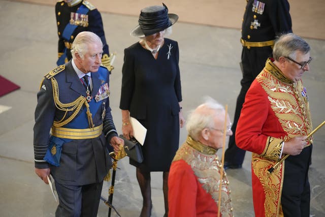King Charles III and the Queen Consort leave after the service and procession for the coffin of Queen Elizabeth II 