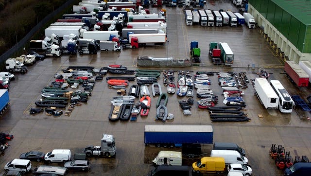 A view of boats used by people thought to be migrants at a storage facility near Dover in Kent