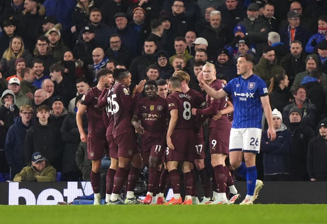 Phil Foden celebrates with this Manchester City team-mates