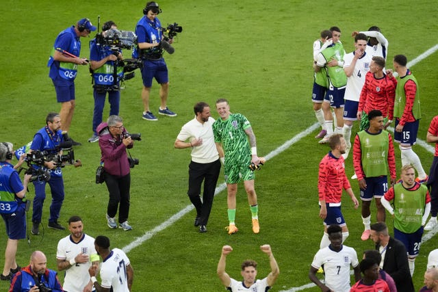 England manager Gareth Southgate (left) celebrates with goalkeeper Jordan Pickford