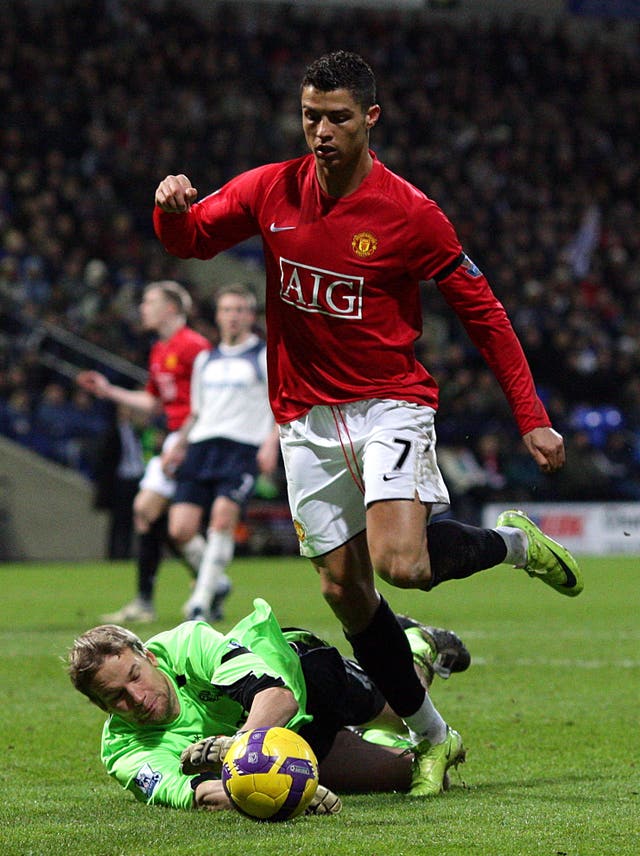Bolton Wanderers' Jussi Jaaskelainen, left, saves from Cristiano Ronaldo in 2009
