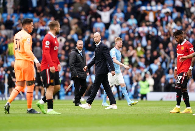 Erik Ten Hag (centre) reacts after the Manchester City defeat