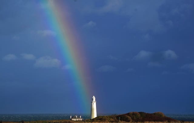 A rainbow over St Mary’s lighthouse in Whitley Bay, Tyne and Wear, as Storm Dudley hits the north of England and southern Scotland from Wednesday night through into Thursday morning, closely followed by Storm Eunice, which will bring strong winds and the possibility of snow on Friday 