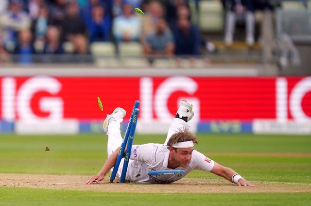Stuart Broad dives and collides with the stumps while attempting to run out Mohammed Siraj, not pictured