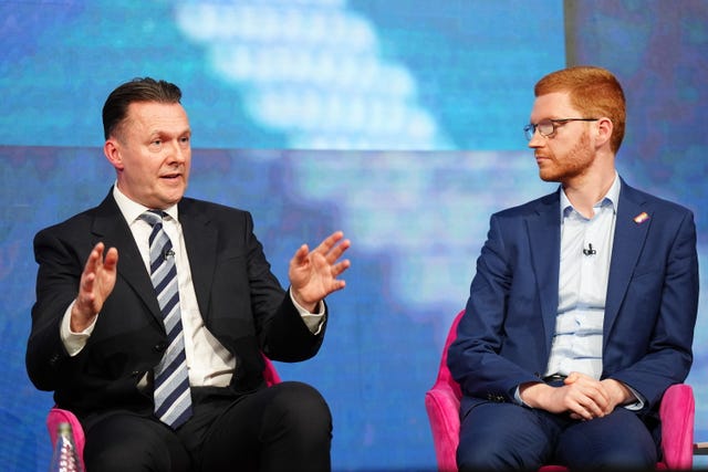 Russell Findlay speaking while seated next to Ross Greer, who is looking at him