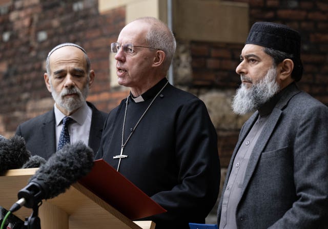 From left: Rabbi Jonathan Wittenberg, Archbishop of Canterbury Justin Welby and Sheikh Ibrahim Mogra make a statement at Lambeth Palace in London 