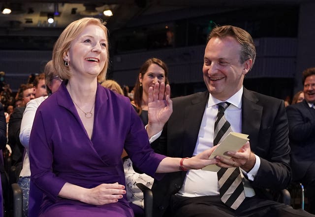 Liz Truss is congratulated by her husband Hugh O’Leary after being announced the winner in the Tory leadership election 