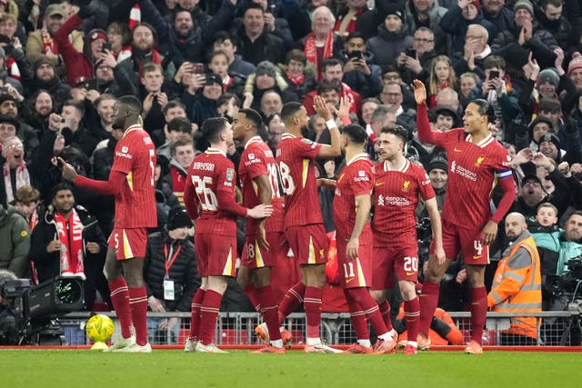 Liverpool players celebrate after scoring their fourth goal