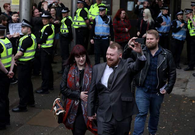 Mark Meechan leaves Airdrie Sheriff Court after being fined over footage which showed a dog giving Nazi salutes (Andrew Milligan/PA)