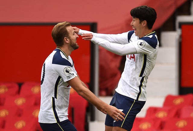Son, right, celebrates with Kane after scoring his side’s second goal at Old Trafford