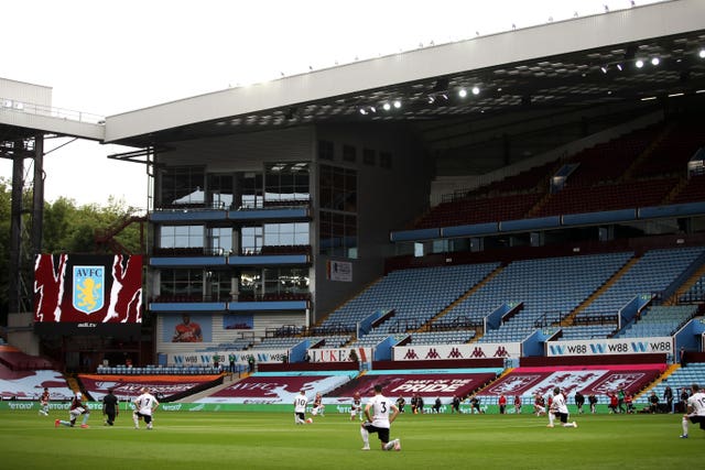 Aston Villa and Sheffield United players take a knee before kick-off in front of empty stands