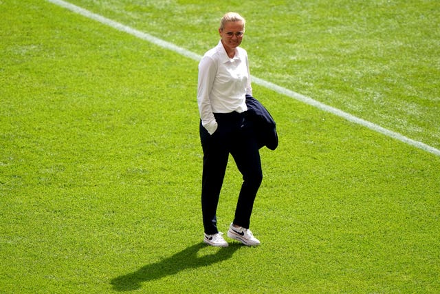 Sarina Wiegman, trademark jacket tucked under her arm, before the Euro 2022 final