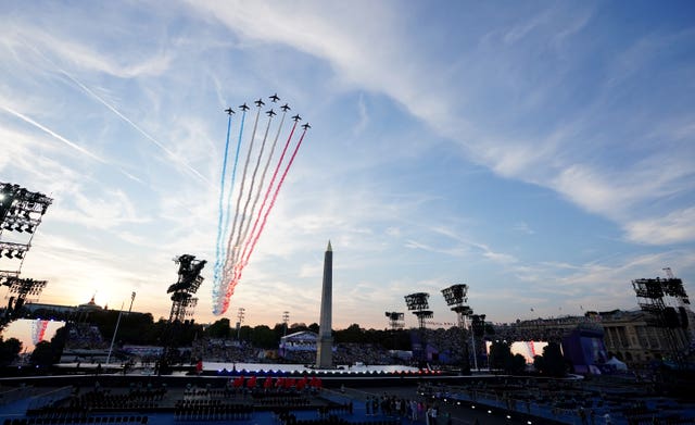 Planes perform a fly past during the opening ceremony 