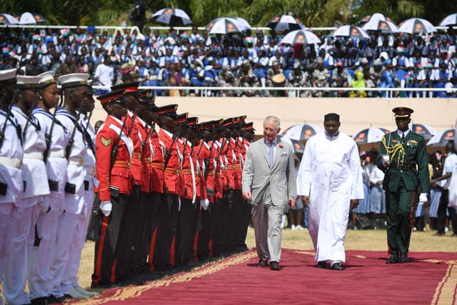 The Prince of Wales with President Adama Barrow in McCarthy Square as the official welcome ceremony began. Joe Giddens/PA Wire