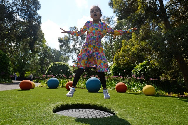 A child on a trampoline in the new garden