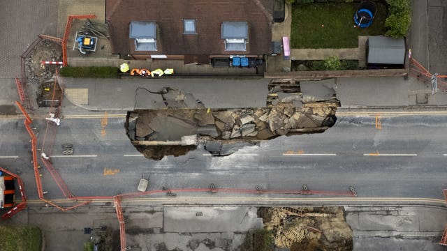 The scene in Godstone where police have evacuated a number of properties and a 100-metre cordon was put in place after a sinkhole appeared in the small village on Monday night.