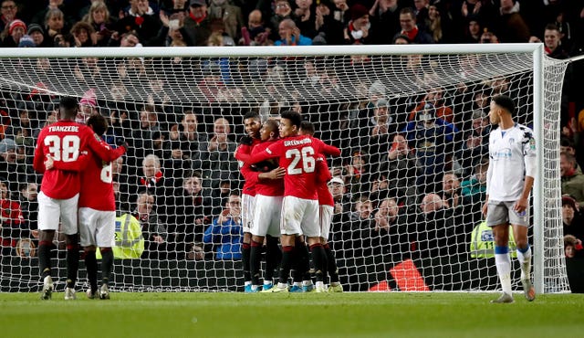 Manchester United celebrate Anthony Martial wrapping up a 3-0 win against Colchester