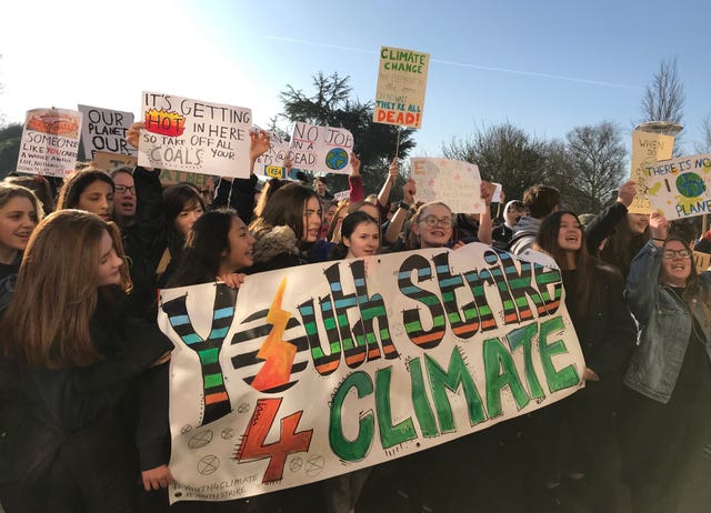 Protesters at a Youth Strike 4 Climate demonstration outside Shire Hall in Cambridge