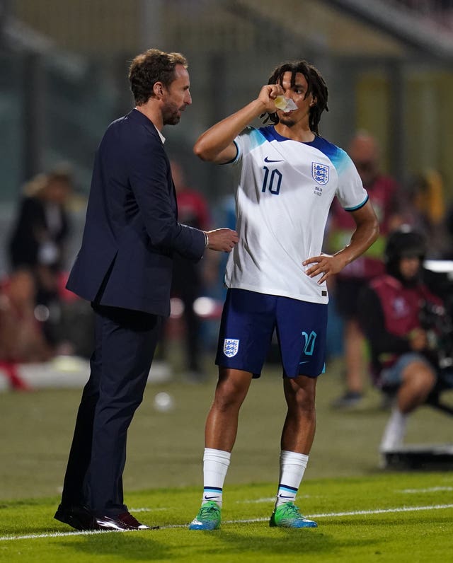 England manager Gareth Southgate and Trent Alexander-Arnold speak on the touchline during the match against Malta