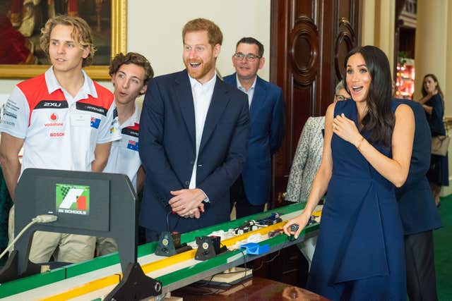 The Duke and Duchess were left in fits of giggles after racing model Formula 1 cars