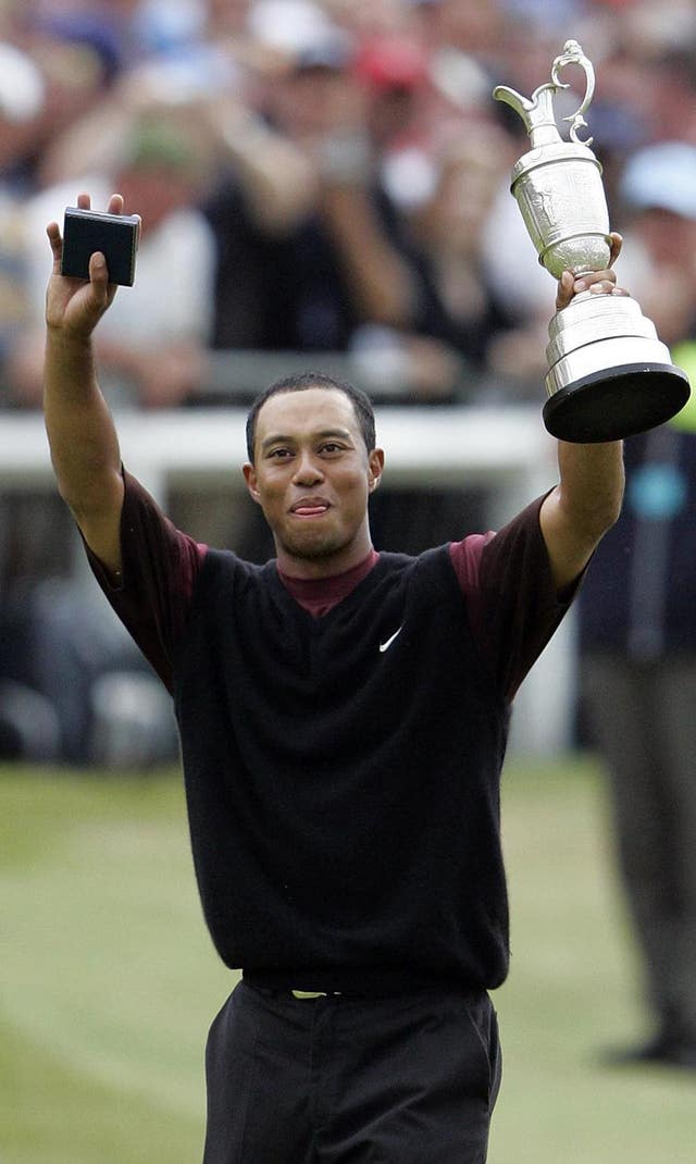 Tiger Woods celebrates winning the 134th Open Championship in 2005