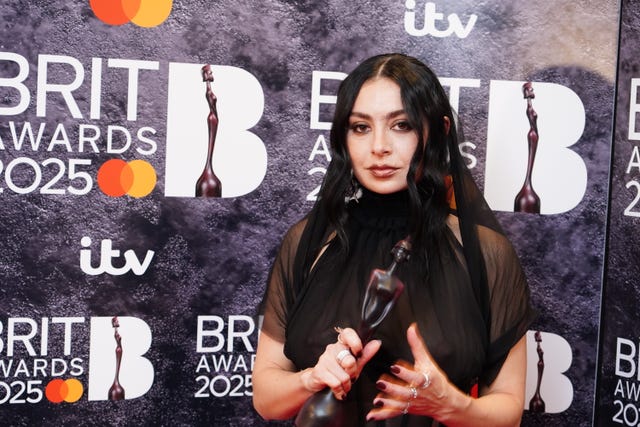 Charli XCX backstage with one of her Brit Awards 